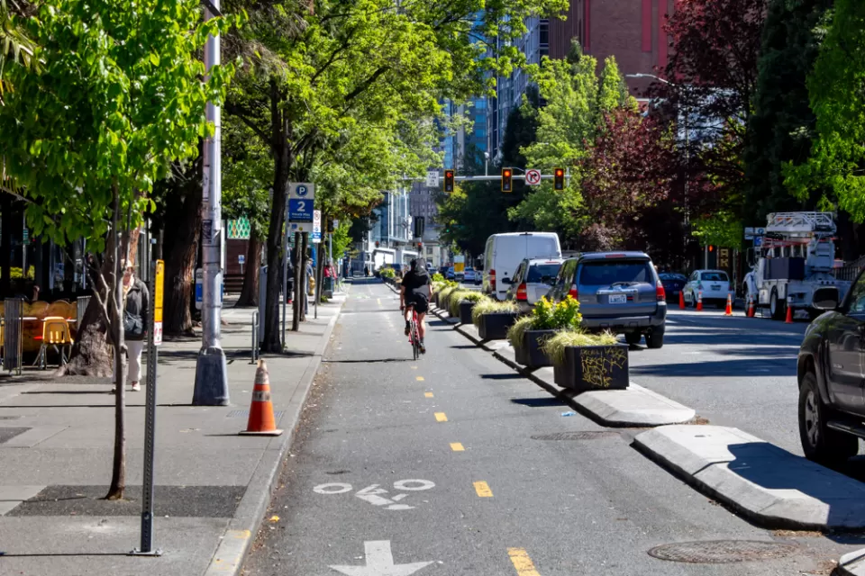 Two-way bike lane in downtown Seattle, Washington protected wtih concrete curbs